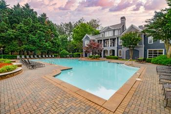 A large house with a pool in the backyard.